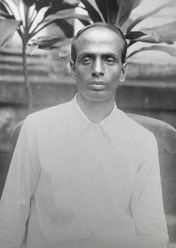 Photographic portrait of Surya Sen seated outdoors in a plain collared shirt, taken before 1934.